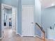 Upstairs hallway with light blue walls and tile floors at 10817 Tarflower Dr # 202, Venice, FL 34293