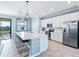 Modern kitchen with white cabinets, quartz countertops, and stainless steel appliances at 10817 Tarflower Dr # 202, Venice, FL 34293