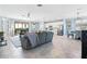 Open living room, kitchen, and dining area with tile floor at 10817 Tarflower Dr # 202, Venice, FL 34293