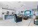 Open concept living room, kitchen, and dining area with modern finishes at 10817 Tarflower Dr # 202, Venice, FL 34293