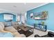 Spacious living room with sectional sofa and large TV at 10817 Tarflower Dr # 202, Venice, FL 34293