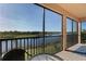 Relaxing screened balcony overlooking serene lake views at 10817 Tarflower Dr # 202, Venice, FL 34293