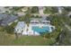 Aerial view of community pool with lounge chairs and cabanas at 1134 Thornbury Dr, Parrish, FL 34219