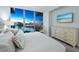 Bedroom with water views and neutral decor at 1155 N Gulfstream Ave # 703, Sarasota, FL 34236