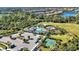 Community pool and amenity area with surrounding landscape at 12689 Promenade Estates Blvd, Sarasota, FL 34238