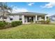 House exterior showcasing a large backyard at 12689 Promenade Estates Blvd, Sarasota, FL 34238