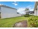 Landscaped backyard with privacy fence at 12689 Promenade Estates Blvd, Sarasota, FL 34238