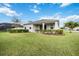 House exterior showcasing a large backyard at 12689 Promenade Estates Blvd, Sarasota, FL 34238