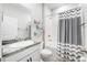 Clean bathroom with granite countertop and tub shower at 12689 Promenade Estates Blvd, Sarasota, FL 34238