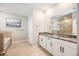 Elegant bathroom with double vanity and granite countertop at 12689 Promenade Estates Blvd, Sarasota, FL 34238