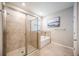 Modern bathroom with a walk-in shower and soaking tub at 12689 Promenade Estates Blvd, Sarasota, FL 34238