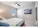 Guest bedroom with a bed and closet, featuring a nautical theme at 12689 Promenade Estates Blvd, Sarasota, FL 34238
