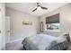Well-lit bedroom with window and ceiling fan at 12689 Promenade Estates Blvd, Sarasota, FL 34238