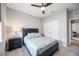 Comfortable bedroom with ceiling fan and double doors at 12689 Promenade Estates Blvd, Sarasota, FL 34238