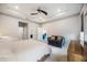 Spacious bedroom with a comfy bed and seating area at 12689 Promenade Estates Blvd, Sarasota, FL 34238