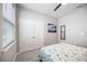 Bright bedroom with a double door closet and a bed at 12689 Promenade Estates Blvd, Sarasota, FL 34238