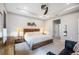 Spacious bedroom with wood furniture and ceiling fan at 12689 Promenade Estates Blvd, Sarasota, FL 34238