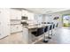 Open concept kitchen with granite island and stainless steel appliances at 12689 Promenade Estates Blvd, Sarasota, FL 34238