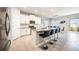 Open concept kitchen with white cabinets and granite countertops at 12689 Promenade Estates Blvd, Sarasota, FL 34238