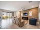 Spacious living room featuring a wood accent wall and comfortable seating at 12689 Promenade Estates Blvd, Sarasota, FL 34238