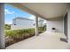 Covered patio with grill space, perfect for outdoor entertaining at 12689 Promenade Estates Blvd, Sarasota, FL 34238