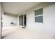 Covered patio with sliding door access to the interior at 12689 Promenade Estates Blvd, Sarasota, FL 34238