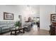 Bright living room with light gray couches and wood floors at 13368 Englewood Rd, Port Charlotte, FL 33981