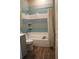 Bathroom with a tub, shower, and multi-colored tile at 1421 14Th N St, St Petersburg, FL 33704