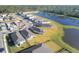Aerial view of houses, lake, and community at 148 Whiteland Bnd, Nokomis, FL 34275