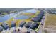 Aerial view of a new neighborhood with houses and a lake at 148 Whiteland Bnd, Nokomis, FL 34275