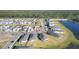 Aerial community view with lake and houses at 148 Whiteland Bnd, Nokomis, FL 34275