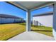 Covered patio overlooking a fenced backyard at 148 Whiteland Bnd, Nokomis, FL 34275