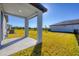 Covered patio with view of backyard and pond at 148 Whiteland Bnd, Nokomis, FL 34275