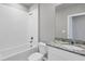 Clean bathroom with a bathtub, toilet and granite countertop at 148 Whiteland Bnd, Nokomis, FL 34275