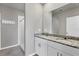 Bathroom with granite countertop double vanity and shower at 148 Whiteland Bnd, Nokomis, FL 34275