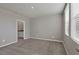 Bright bedroom with neutral decor and en-suite bathroom access at 148 Whiteland Bnd, Nokomis, FL 34275
