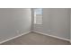 Empty bedroom with neutral walls and carpet flooring at 148 Whiteland Bnd, Nokomis, FL 34275