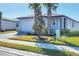 Front view of a single-story house with a two-car garage at 148 Whiteland Bnd, Nokomis, FL 34275