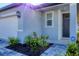 House entrance with gray door and ADT security system at 148 Whiteland Bnd, Nokomis, FL 34275