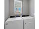 Convenient laundry room with Whirlpool washer and dryer at 148 Whiteland Bnd, Nokomis, FL 34275