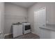 Laundry room with washer, dryer, and overhead shelving at 16128 67Th E Ct, Parrish, FL 34219