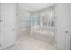 Modern bathroom with soaking tub and walk-in shower at 1815 Grove St, Sarasota, FL 34239