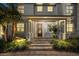 Front entrance of a two-story house with a brown door and stone steps at 1815 Grove St, Sarasota, FL 34239