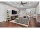 Bright living room with hardwood floors, sectional sofa and flat screen TV at 1815 Grove St, Sarasota, FL 34239