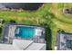 Aerial view of the property showcasing the pool and surrounding landscape at 18212 Cayo Largo Pl, Bradenton, FL 34202