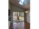 Dining area with sliding glass doors to the patio and wood-look flooring at 2072 Misty Sunrise Trl, Sarasota, FL 34240