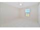 Spacious bedroom with tile floors and a large window at 2073 Damascus Ln, Punta Gorda, FL 33983