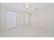 Well-lit bedroom with double door closet and tile floors at 2073 Damascus Ln, Punta Gorda, FL 33983