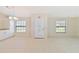 Bright and spacious entryway with tile flooring and access to kitchen at 2073 Damascus Ln, Punta Gorda, FL 33983
