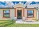 House entrance with decorative columns and a security door at 2073 Damascus Ln, Punta Gorda, FL 33983